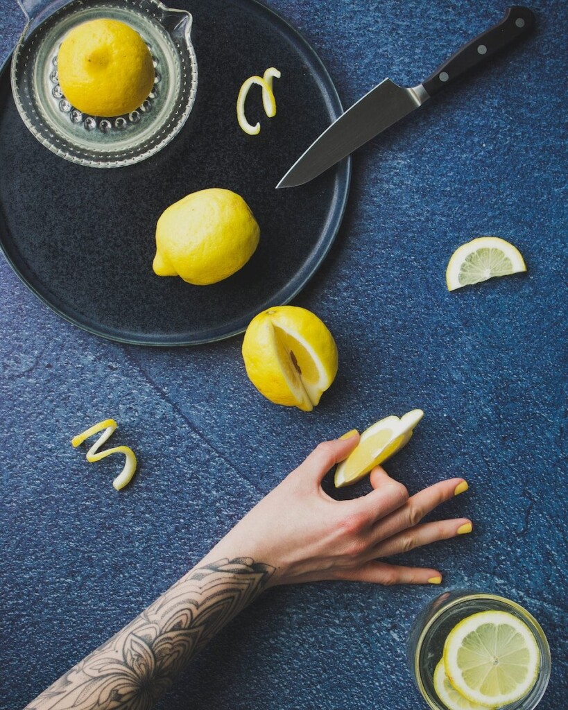 sliced lemon on chopping board